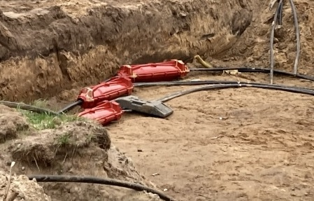 Installatie kabbelmoffen in zand